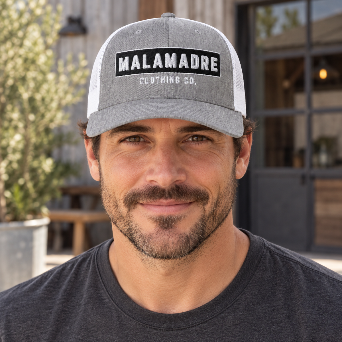 AI lifestyle mockup of MALAMADRE CLASSIC Trucker; original product detail images retained
